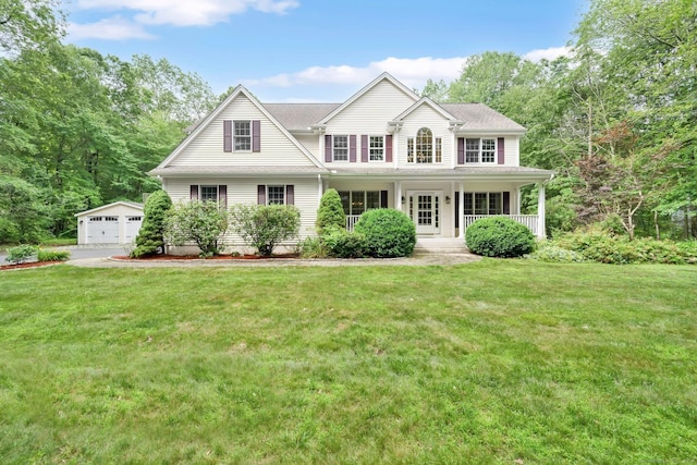 190 Charles St, Tolland, CT 06084 - view of front of home featuring an outdoor structure, a garage, a porch, and a front lawn