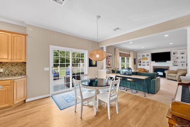 190 Charles St, Tolland, CT 06084 - dining space with light wood-type flooring, crown molding, a fireplace, and recessed lighting