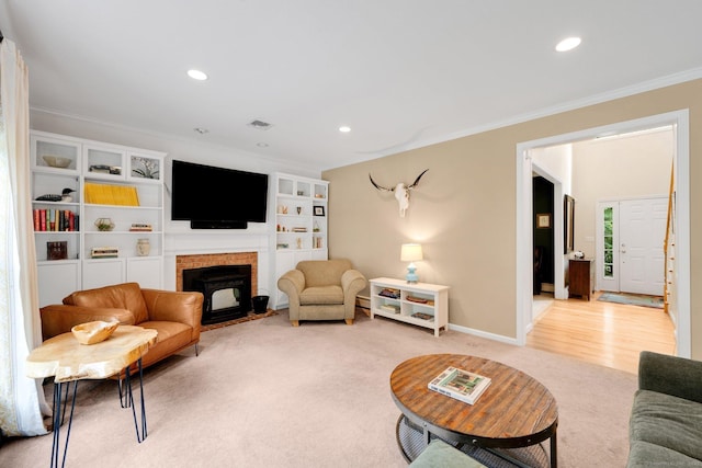 190 Charles St, Tolland, CT 06084 - living area featuring ornamental molding, recessed lighting, a fireplace, and light colored carpet