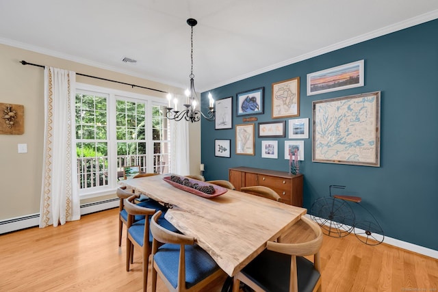 190 Charles St, Tolland, CT 06084 - dining space featuring a chandelier, light wood-type flooring, ornamental molding, and a baseboard heating unit