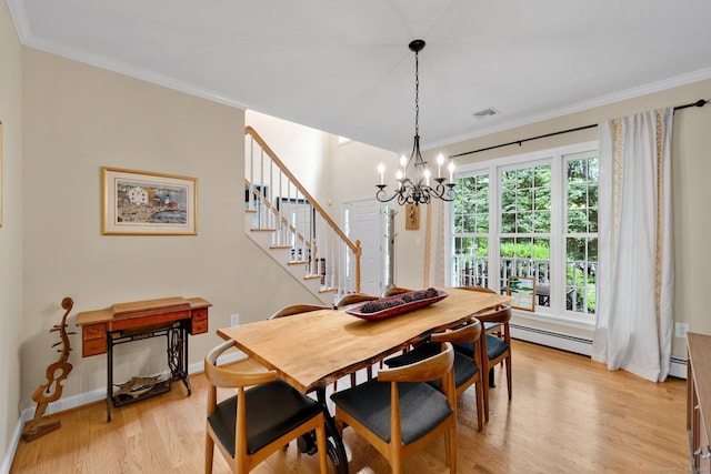 190 Charles St, Tolland, CT 06084 - dining space with light wood-type flooring, stairs, ornamental molding, a baseboard heating unit, and a chandelier