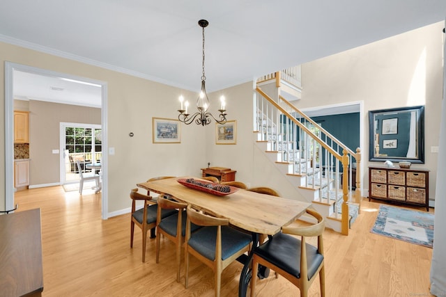 190 Charles St, Tolland, CT 06084 - dining space with light wood-type flooring, a chandelier, stairway, ornamental molding, and baseboard heating