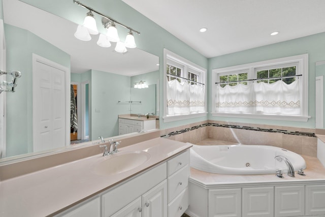 190 Charles St, Tolland, CT 06084 - full bath with vanity, a tub with jets, recessed lighting, and a spacious closet