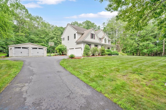 190 Charles St, Tolland, CT 06084 - view of front facade with a front lawn and a detached garage