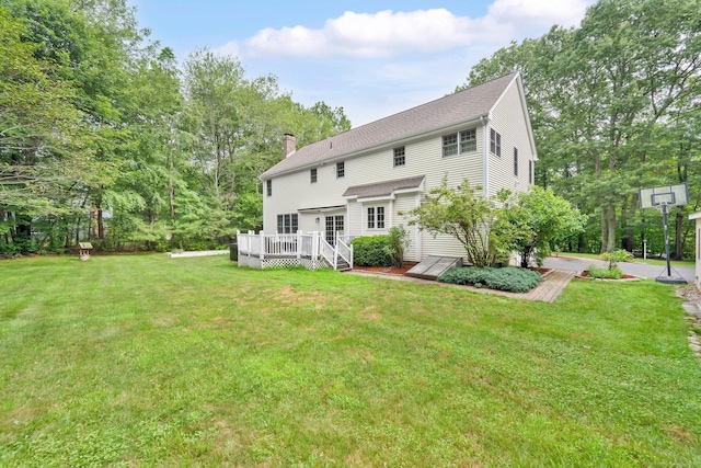 190 Charles St, Tolland, CT 06084 - rear view of house with a deck, a chimney, a yard, and a shingled roof