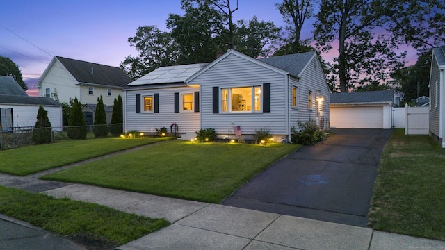 107 May St, West Haven, CT 06516 - view of front of house with roof mounted solar panels and a garage