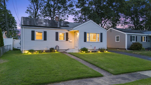 107 May St, West Haven, CT 06516 - view of front of home with solar panels, a chimney, and roof with shingles