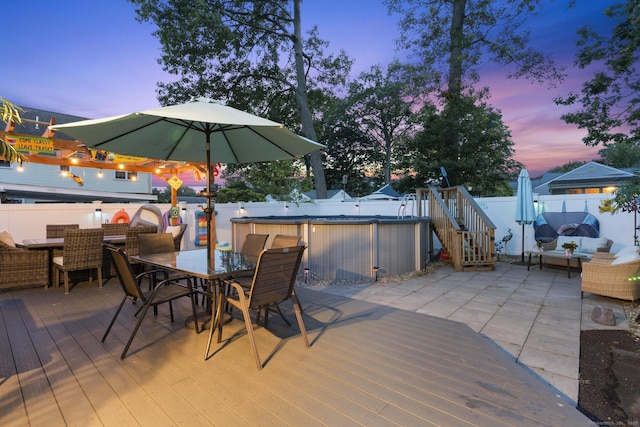 107 May St, West Haven, CT 06516 - deck at dusk featuring outdoor dining area and a fenced backyard