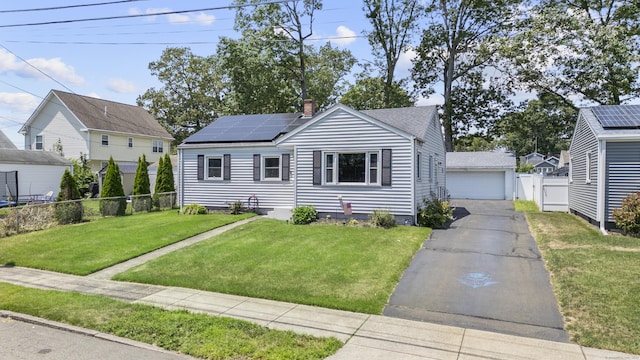 107 May St, West Haven, CT 06516 - bungalow featuring solar panels, a detached garage, and a chimney