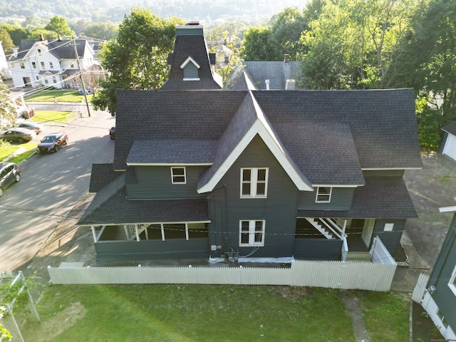 122 Oak St, Naugatuck, CT 06770 - back of house with roof with shingles, a chimney, and a patio