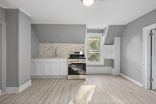 122 Oak St, Naugatuck, CT 06770 - kitchen with stainless steel electric range oven, light wood finished floors, light countertops, decorative backsplash, and white cabinets