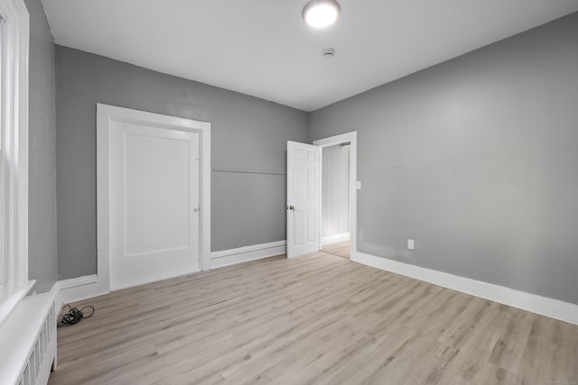 122 Oak St, Naugatuck, CT 06770 - unfurnished bedroom featuring light wood-style floors and baseboards