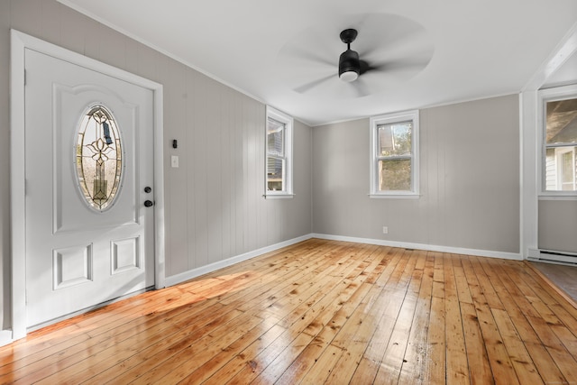 122 Oak St, Naugatuck, CT 06770 - entryway featuring wood-type flooring, ceiling fan, healthy amount of natural light, crown molding, and a baseboard heating unit