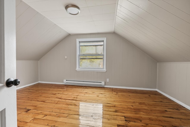 122 Oak St, Naugatuck, CT 06770 - additional living space with a baseboard heating unit, hardwood / wood-style flooring, and vaulted ceiling