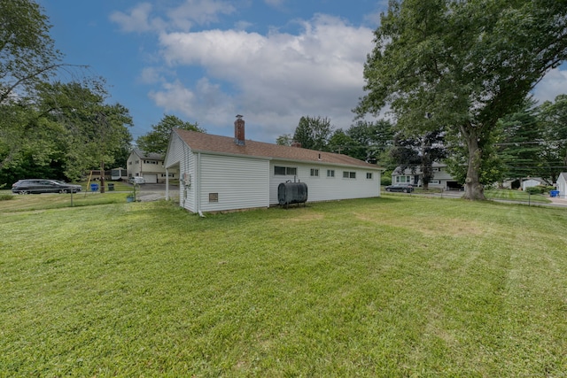 55 Taylor Rd, East Hartford, CT 06110 - back of house with heating fuel and a chimney