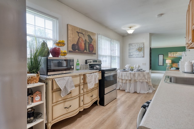 55 Taylor Rd, East Hartford, CT 06110 - kitchen with appliances with stainless steel finishes, light wood-type flooring, plenty of natural light, and light countertops