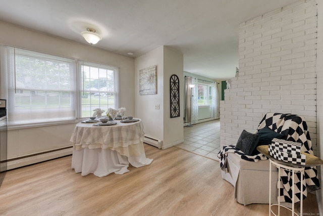 55 Taylor Rd, East Hartford, CT 06110 - dining room featuring light wood-style flooring, a baseboard heating unit, and baseboard heating