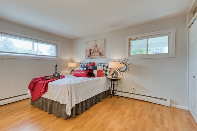55 Taylor Rd, East Hartford, CT 06110 - bedroom with a baseboard radiator and wood finished floors