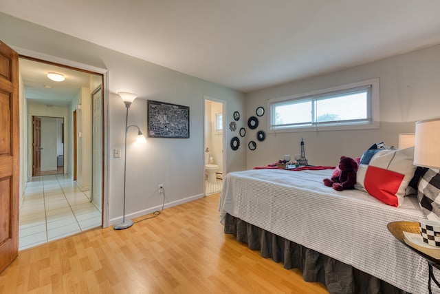 55 Taylor Rd, East Hartford, CT 06110 - bedroom with light wood-style floors and connected bathroom