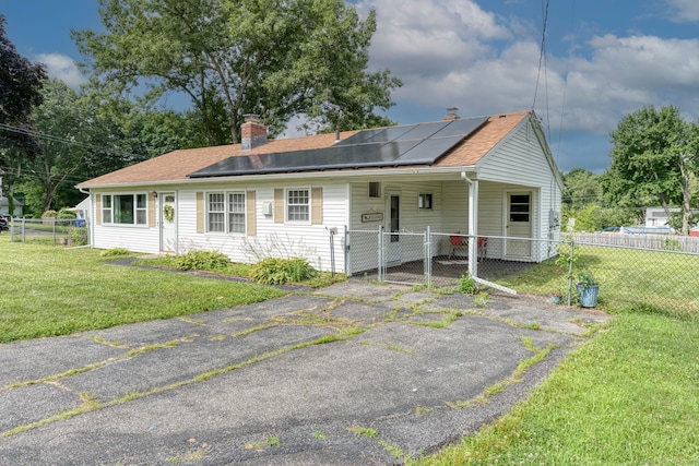 55 Taylor Rd, East Hartford, CT 06110 - view of front of property with a chimney, solar panels, a gate, and roof with shingles