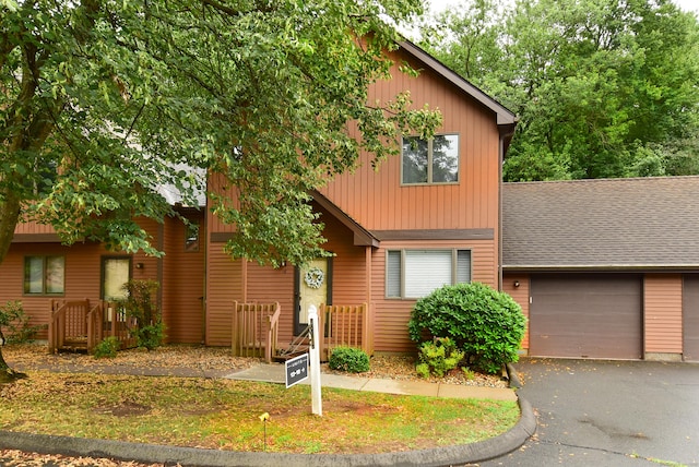 105 Maple Ave Apt 16, Vernon, CT 06066 - view of front facade featuring driveway, an attached garage, and roof with shingles
