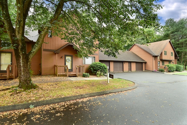105 Maple Ave Apt 16, Vernon, CT 06066 - view of front of property featuring asphalt driveway, roof with shingles, and an attached garage