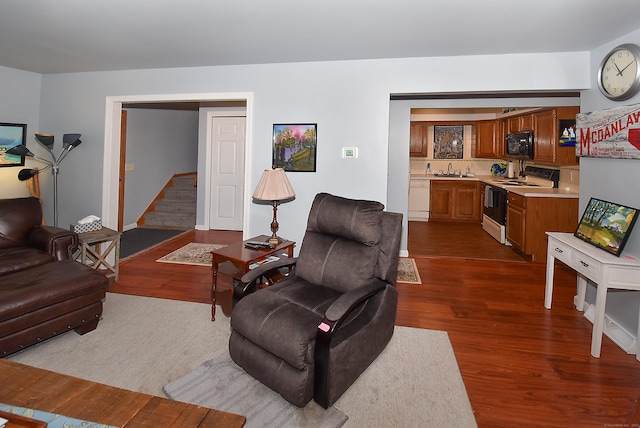 105 Maple Ave Apt 16, Vernon, CT 06066 - living area with dark wood-style floors and stairway