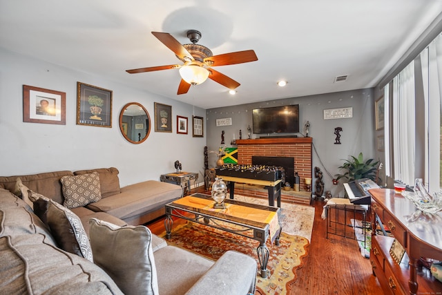 87 Kaynor Dr, Waterbury, CT 06708 - living room with ceiling fan, wood finished floors, a brick fireplace, and recessed lighting