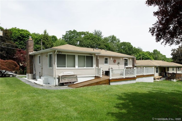 87 Kaynor Dr, Waterbury, CT 06708 - rear view of property with a wooden deck, a chimney, and a yard