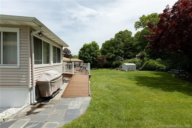 87 Kaynor Dr, Waterbury, CT 06708 - view of grassy yard with a shed and a deck