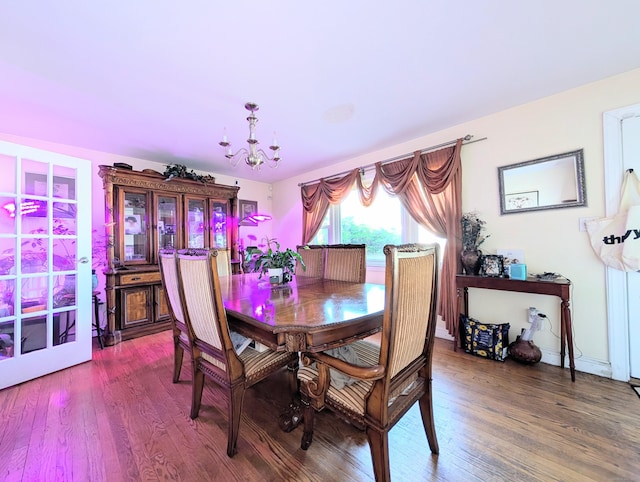 943 Success Ave, Stratford, CT 06614 - dining area with a chandelier and wood finished floors