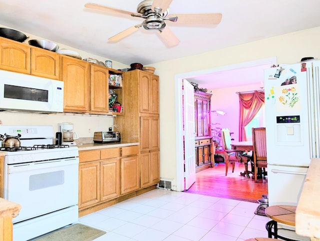 943 Success Ave, Stratford, CT 06614 - kitchen with white appliances, light tile patterned floors, light countertops, ceiling fan, and open shelves