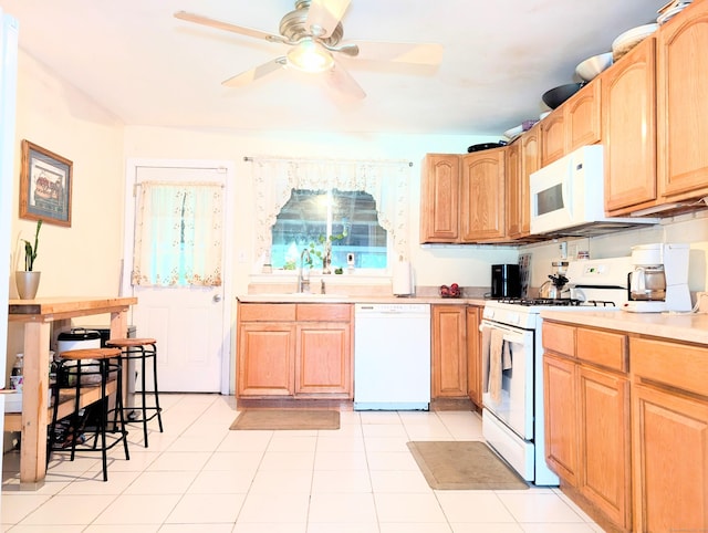 943 Success Ave, Stratford, CT 06614 - kitchen featuring white appliances, a ceiling fan, light countertops, and light brown cabinetry