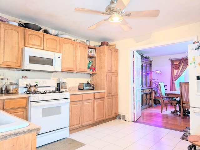 943 Success Ave, Stratford, CT 06614 - kitchen with white appliances, light countertops, and light brown cabinetry