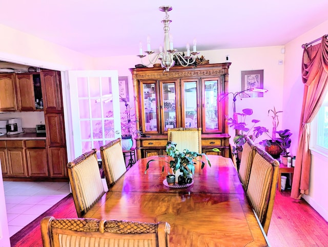 943 Success Ave, Stratford, CT 06614 - dining space featuring a chandelier and light wood-type flooring
