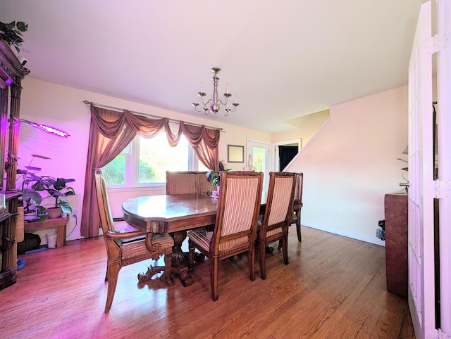 943 Success Ave, Stratford, CT 06614 - dining area with wood finished floors and a chandelier