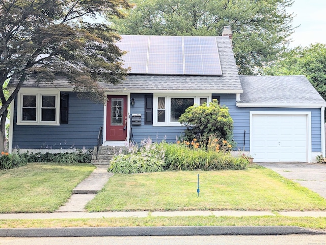 943 Success Ave, Stratford, CT 06614 - view of front facade with a front yard, roof mounted solar panels, a garage, driveway, and a chimney
