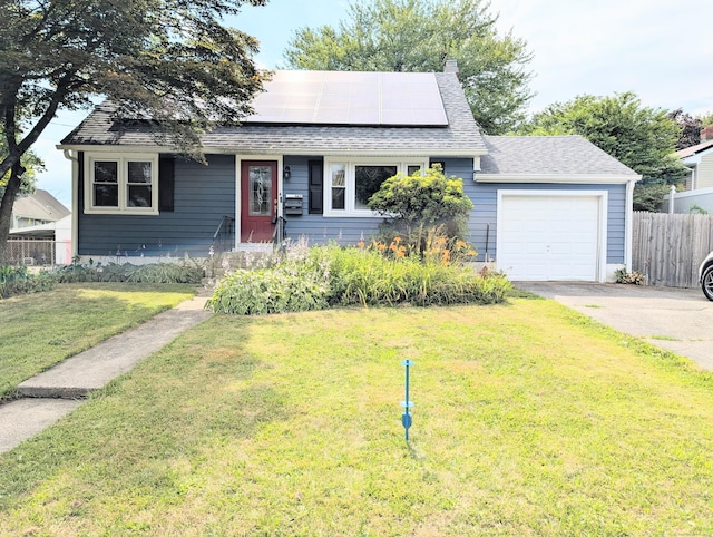 943 Success Ave, Stratford, CT 06614 - view of front of home featuring an attached garage, solar panels, roof with shingles, and concrete driveway