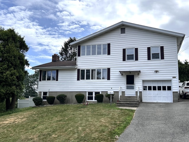 2 Wentworth Dr, Milford, CT 06460 - view of front of property with a chimney, an attached garage, and asphalt driveway