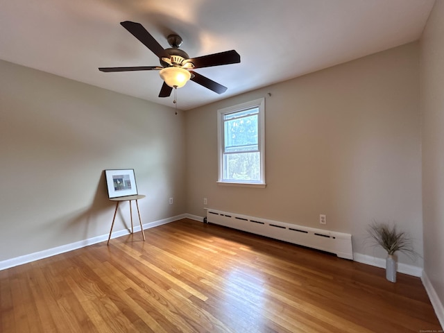 2 Wentworth Dr, Milford, CT 06460 - unfurnished room with a baseboard heating unit, light wood-style flooring, and a ceiling fan