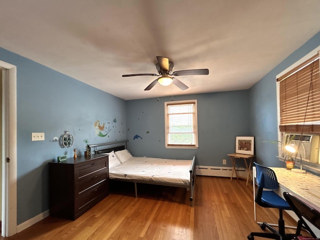2 Wentworth Dr, Milford, CT 06460 - bedroom featuring a baseboard heating unit, light wood-type flooring, a desk, cooling unit, and a ceiling fan