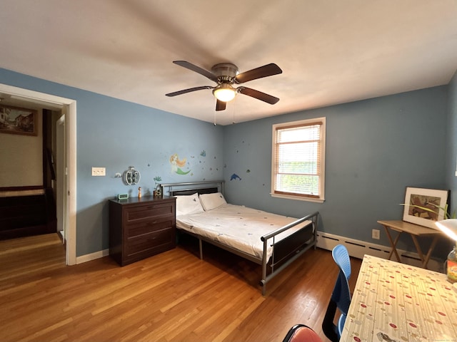 2 Wentworth Dr, Milford, CT 06460 - bedroom with light wood-style floors, a ceiling fan, and a baseboard radiator