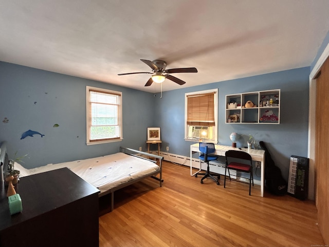 2 Wentworth Dr, Milford, CT 06460 - office area featuring wood finished floors, ceiling fan, a baseboard radiator, and cooling unit