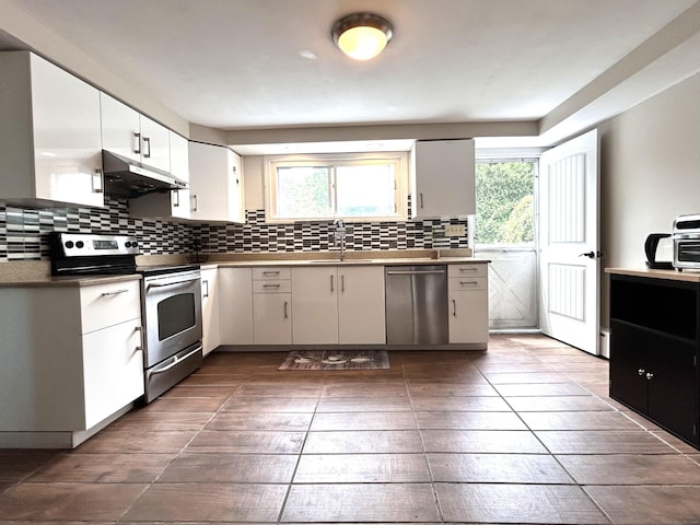 2 Wentworth Dr, Milford, CT 06460 - kitchen featuring stainless steel appliances, range hood, decorative backsplash, and healthy amount of natural light