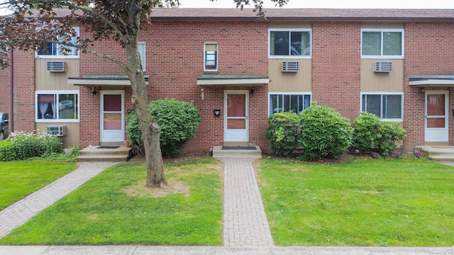 275 Pierremount Ave Unit 275, New Britain, CT 06053 - multi unit property with brick siding, a front yard, and an AC wall unit