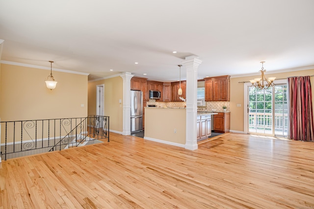 15 Sky Edge Ln, Bethel, CT 06801 - unfurnished living room featuring light wood-style floors, crown molding, a chandelier, and recessed lighting