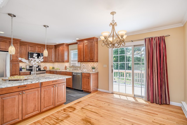 15 Sky Edge Ln, Bethel, CT 06801 - kitchen with appliances with stainless steel finishes, light wood-style floors, a chandelier, backsplash, and brown cabinetry