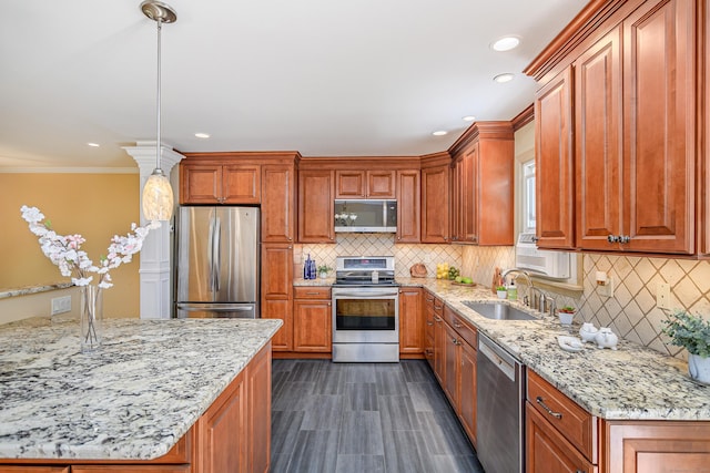 15 Sky Edge Ln, Bethel, CT 06801 - kitchen featuring stainless steel appliances, backsplash, light stone counters, brown cabinetry, and recessed lighting