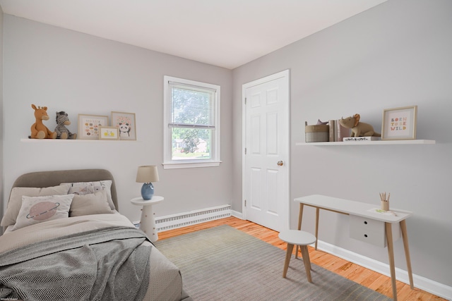 15 Sky Edge Ln, Bethel, CT 06801 - bedroom featuring wood finished floors and a baseboard heating unit