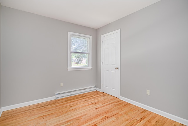 15 Sky Edge Ln, Bethel, CT 06801 - spare room featuring light wood-style flooring and a baseboard radiator